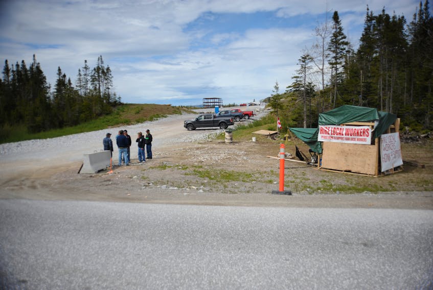 Ironworkers will be able to continue their protest outside the construction site of the regional hospital in Corner Brook, but will have restrictions on stopping vehicles entering the site.