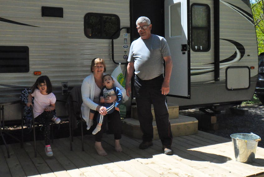 The O’Neill family of Stephenville pose for a photo in front of their trailer while camping at Zenzville Park in Kippens on Friday at noon hour, including from left: Maya, Matthew, Debbie and Paul.