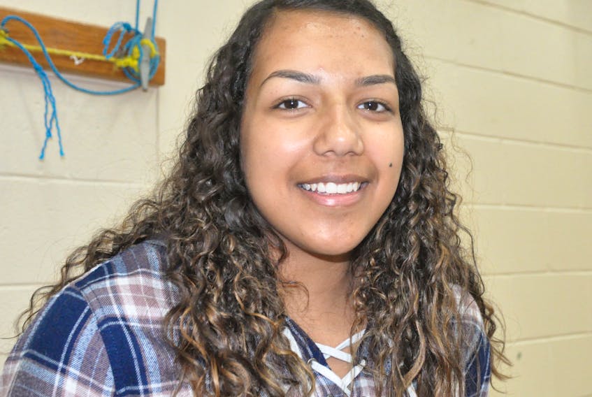 Brianna Barter, a Grade 12 student at École-Sainte-Anne in Mainland poses for a photo after commenting on an announcement by the provincial government of a contribution towards a new cellular service for Mainland and Three Rock Cove.