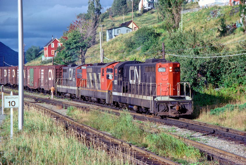This photo is dated Sept 1, 1977 and shows a freight train entering the yard at Corner Brook. - Larry Broadbent photo