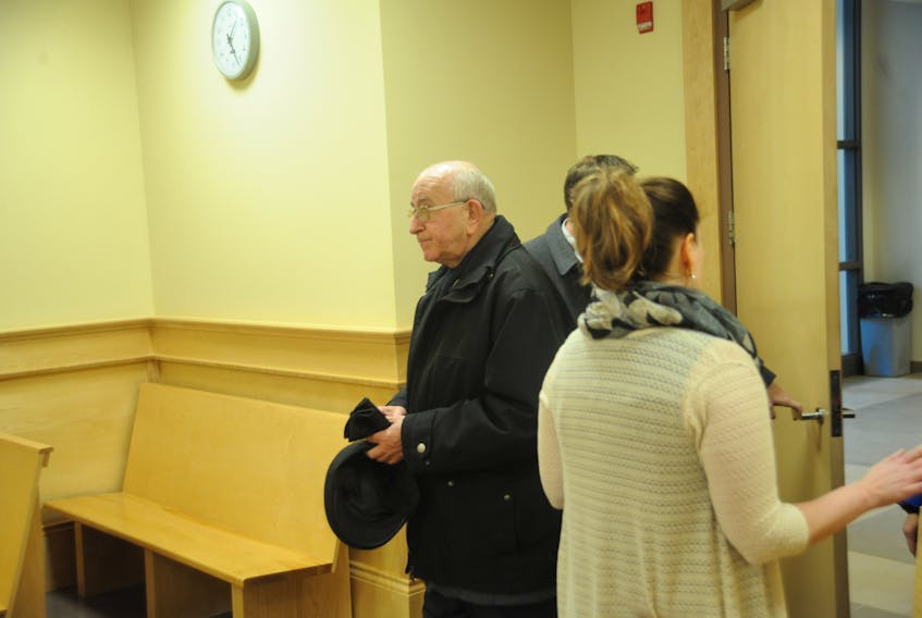 Retired Catholic priest George Smith arrives at provincial court in Corner Brook earlier this week to be sentenced for indecently assaulting an altar boy nearly 40 years ago.