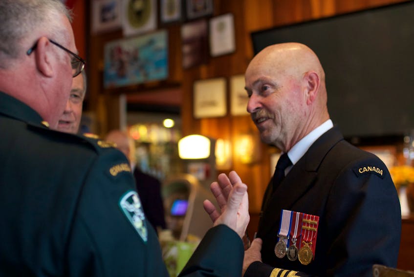 Lt.-Cmdr Gerald Hartley (right) of Corner Brook retired from a nearly 50-year association with the sea cadet movement during a special ceremony held in his honour at the Gallipoli Armoury in the city Friday evening.