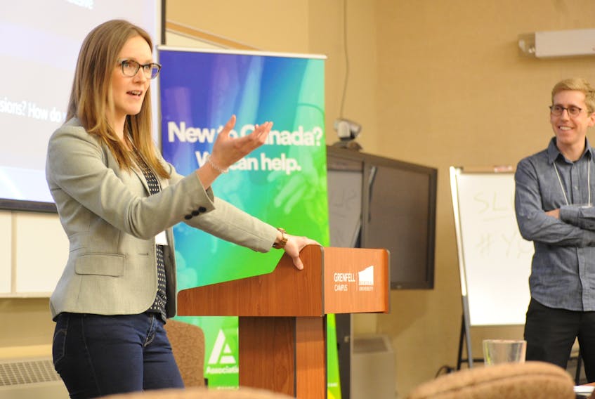 Emily Brennan, marketing manager with Alongside, a company that facilitates online hiring, speaks at the Innovation 2.0 conference in Corner Brook Monday. Looking on to the right is Billy Newell of the Navigate Entrepreneurial Centre at Grenfell Campus, Memorial University.
