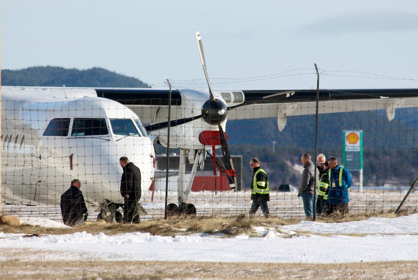 Maintenance workers with Provincial Airlines were carrying out an inspection and repairs on Friday to the Dash 8 airplane that made an emergency controlled landing at Stephenville airport on Thursday, dropping into a nose down position.