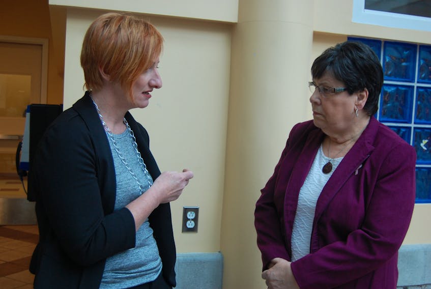 Cindy Davis, left, vice-president of patient services with Western Health, talks with Laura Aylward, chair of the Sir Thomas Roddick Hospital Foundation, about the foundation’s 30-year history.