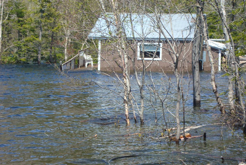 Water levels in Bottomless Pond are still on the rise, according to cabin owner Mark Hoyles. The cabin pictured here belongs to another property affected in the area.