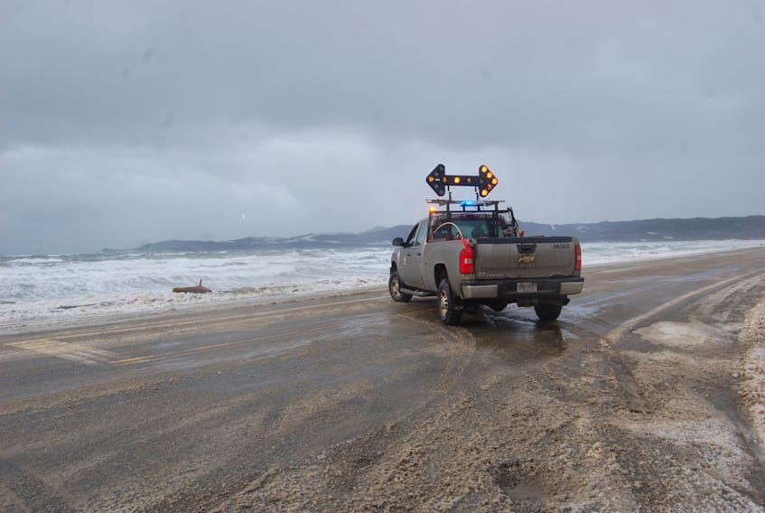 A Transportation and Works pickup is used to divert traffic into Stephenville Crossing at Ocean Drive during the closure of a section of Roxon Way (Route 490) on Wednesday after high waves went over the road near Stephenville Crossing beach resulting in a nearly three and a half hour closure.