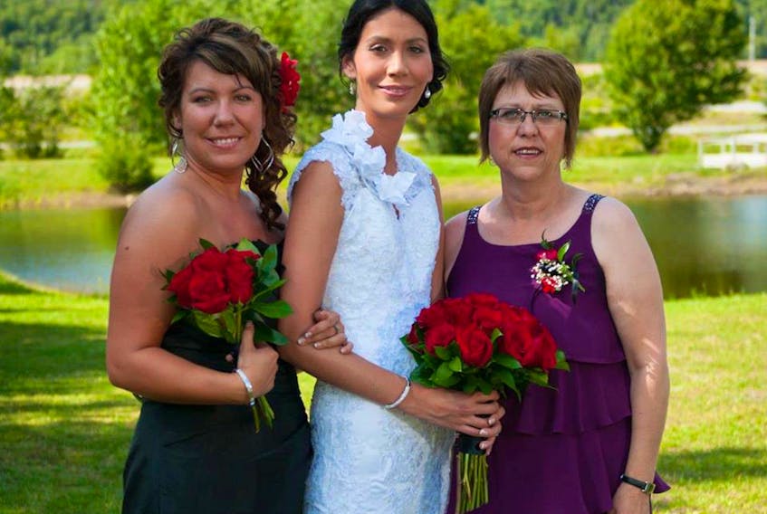 Sara Budgen (centre) has started a clothing line in aid of mental health in honour of her sister Stephanie (right) who took her own life in December. The sisters are shown here with with their mother Ann Marie Cunard during Sara’s wedding.