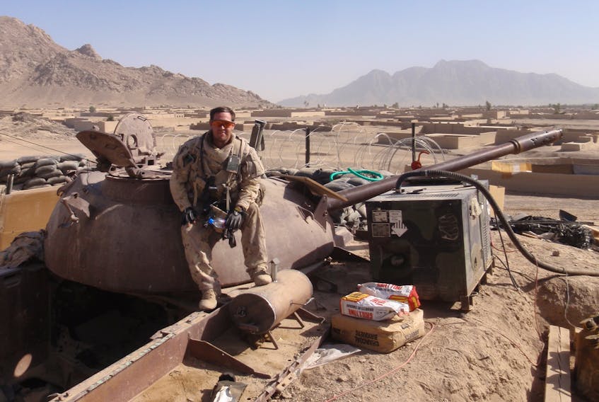 Corner Brook native Justin Eddison had to adjust to life away from a combat zone when he returned home after his tour of duty in Afghanistan in 2010. This photo shows Eddison sitting on top of an old Russian tank from the Russian invasion in Panjwai district Afghanistan.