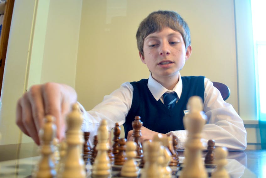 Daley Merrigan moves one of his pieces around the chess board during a match at his home in Corner Brook Wednesday afternoon. Merrigan will represent his province at the 2018 edition of the Canadian Chess Challenge being held in St. John’s May 20-21.