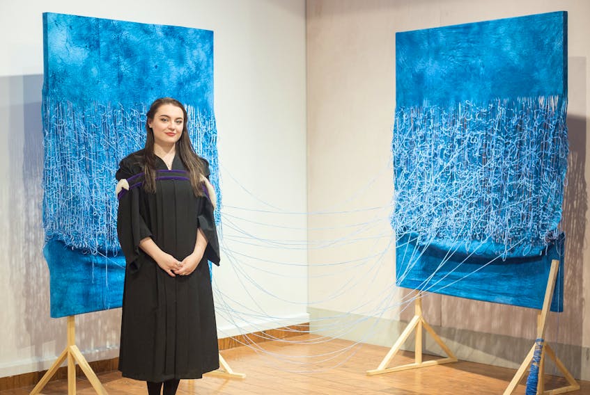 Grenfell Campus graduate Emma Burry poses for a photo of her artwork, “Longing Expanse,” which was a regional winner at this year’s BMO 1st Art! national competition.