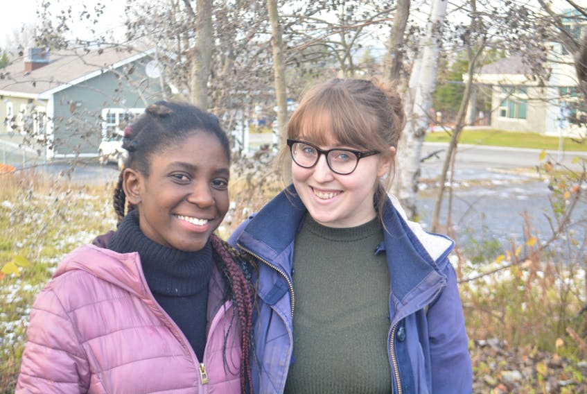 Margarette Leandre (left) and Quinn Anderson pose for a photo outside Brewed Awakening’s Mt. Bernard Avenue location earlier this week. The pair alternates hosting duties for the weekly trivia night at The Backlot on the Grenfell University campus.