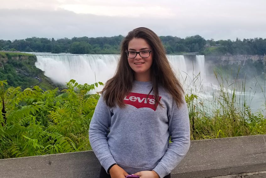 Corner Brook’s Taylor Cormier poses for a photo in front of Niagara Falls while taking a break from a national skills competition earlier this year.