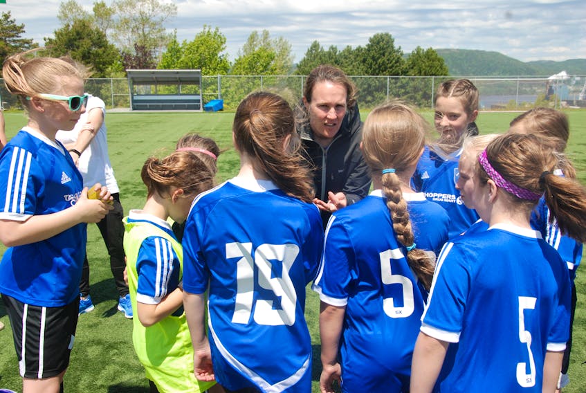 Brooke Wiseman delivers a pep talk to members of her female soccer team earlier this year.