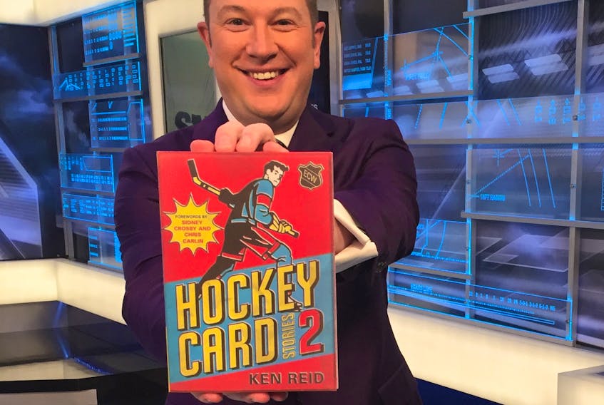 Author/sports anchor Ken Reid poses with his new book, “Hockey Card Stories 2.”