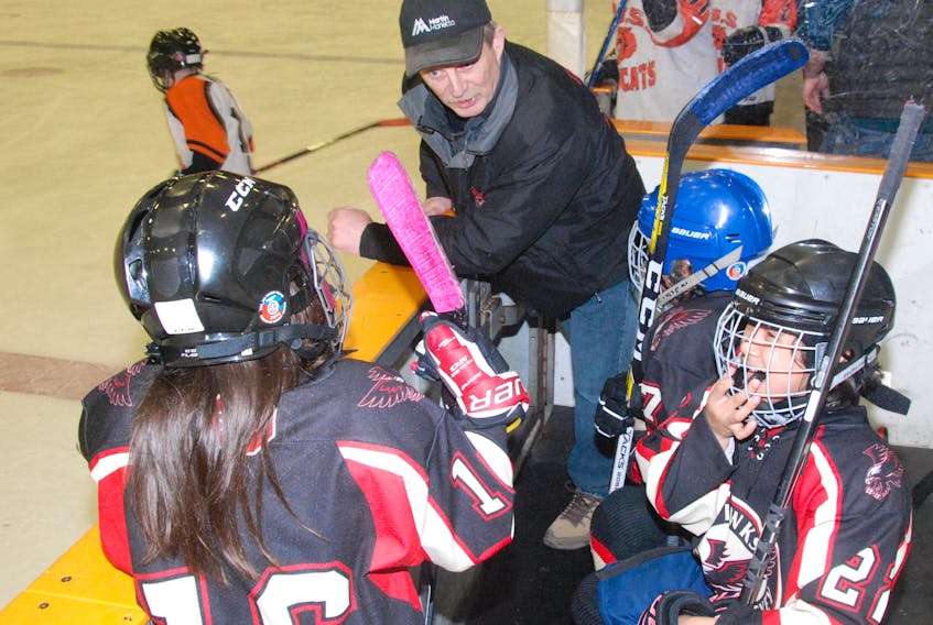 Coach Juan Strickland encourages his players during a round-robin game at the 2018 Hockey Newfoundland and Labrador Atom G Championship being held in Corner Brook this week.
