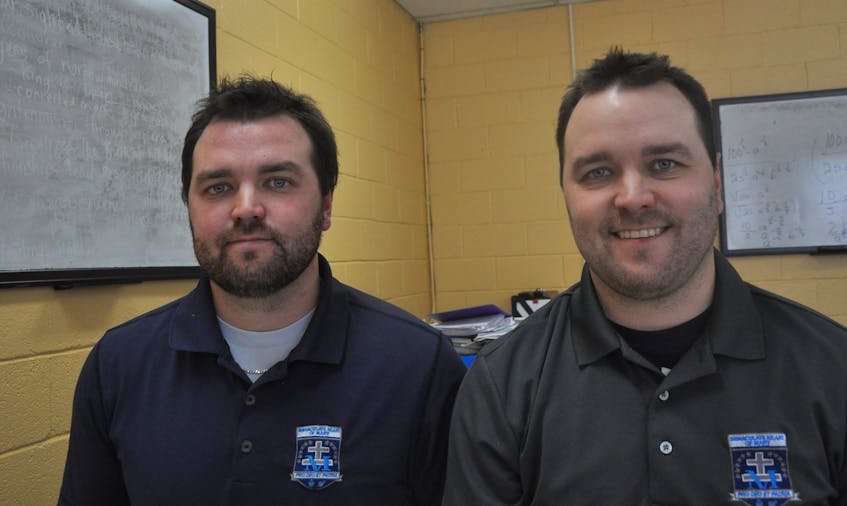 Identical twins Ryley, right, and Drew Nadon pose for a photo at Immaculate Heart of Mary School where the two Port aux Basques Mariners are employed as teachers and coaches of all the sports teams at the school.