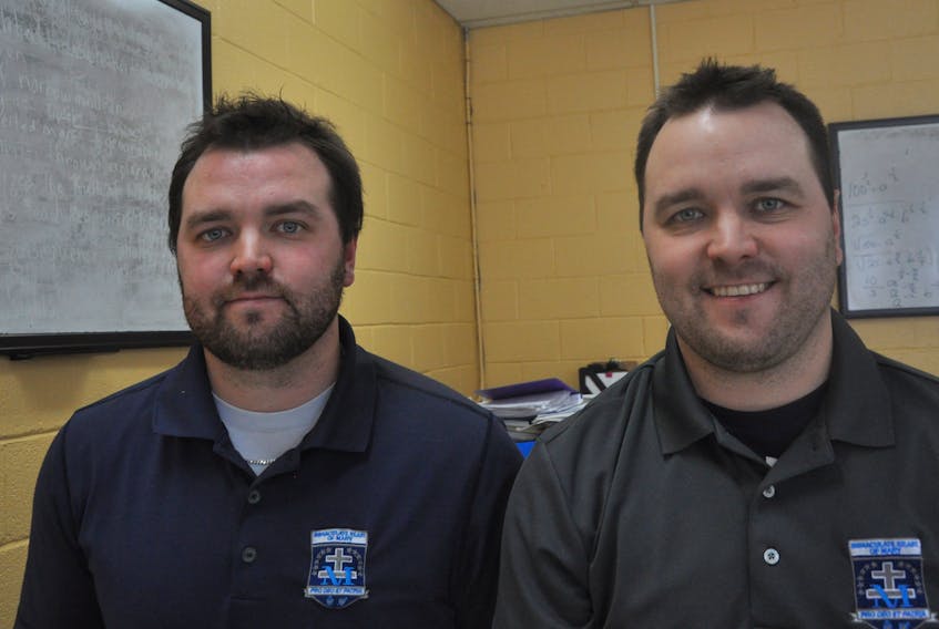 Identical twins Ryley, right, and Drew Nadon pose for a photo at Immaculate Heart of Mary School where the two Port aux Basques Mariners are employed as teachers and coaches of all the sports teams at the school.