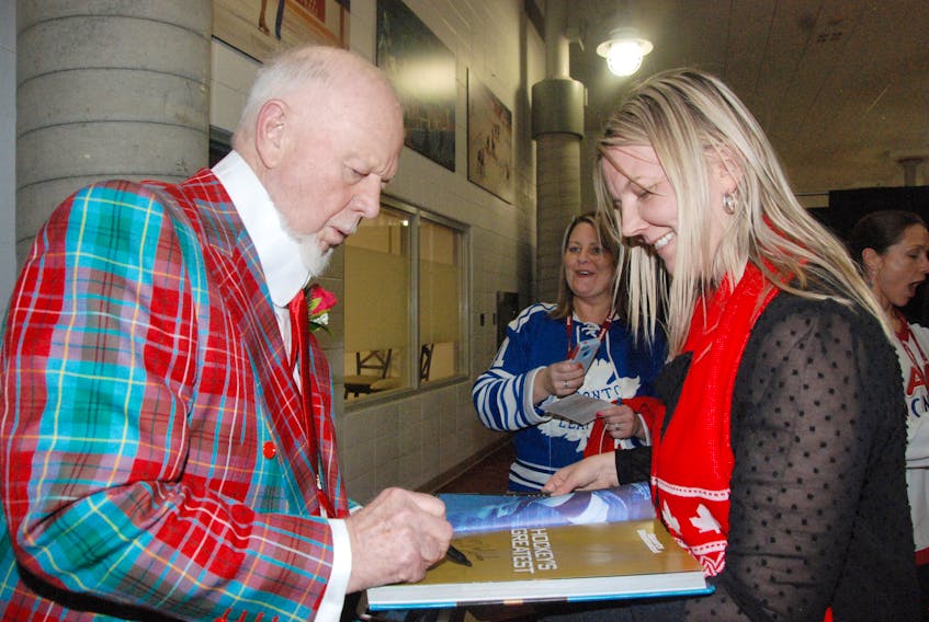Don Cherry signs a book for Corner Brook’s Linda Spingle during the 2018 Hockey Day in Canada gala banquet Thursday night, while her friend Joanne Grenning waits patiently for her chance to meet Cherry.