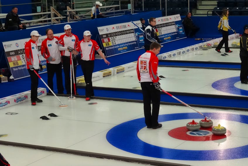 Coach Dennis Bruce calls a timeout for Team Newfoundland and Labrador during a round-robin game against Prince Edward Island Tuesday at the 2018 New Holland Canadian Junior Men’s Curling Championship in Shawinigan, Que. The Daniel Bruce foursome, shown here, eked out an 8-7 win to improve to 3-3 and earn a playoff berth.