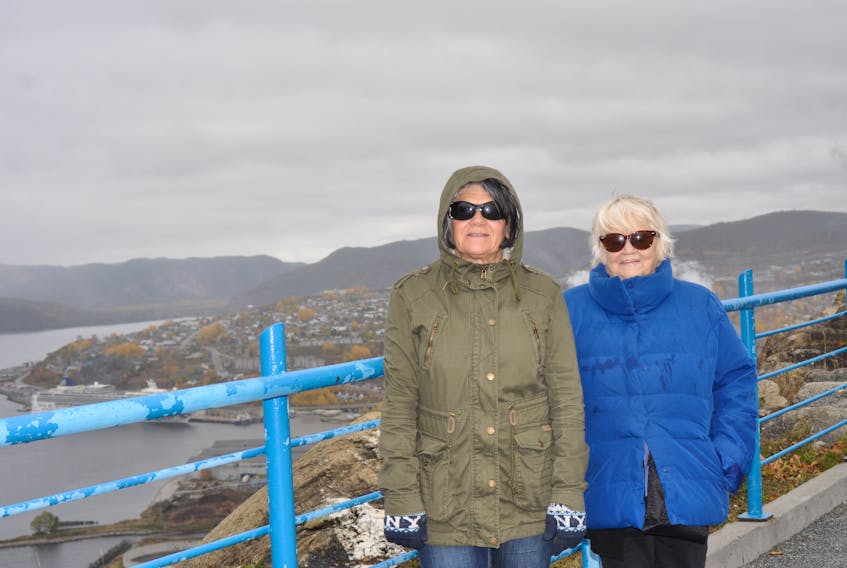 Peggy Fulton, left, and her mother Marilyn Farand of Alberta pose for a picture at the Captain James Cook Historic Site in Corner Brook on Saturday. The women were among the passengers on the Norwegian Cruise Line's Norwegian Gem cruise ship that called into port for the day.
