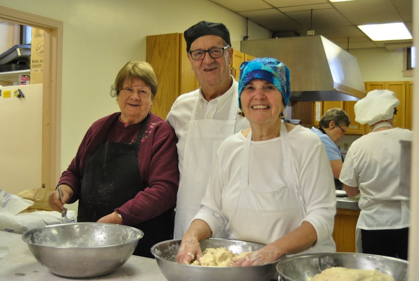 There was some pretty intense pie-making going on at St. John the Evangelist Anglican Cathedral in Corner Brook on Wednesday as volunteers put together some 700 ready-to-bake pies as a fundraiser for the church. It’s the second year the church has held the pie fundraiser. Elaine Watton, left, and Connie Lamswood, right, helped mix up the dough for the pie crusts, and are seen here with Stelman Flynn, who organized and oversaw the pie-making.