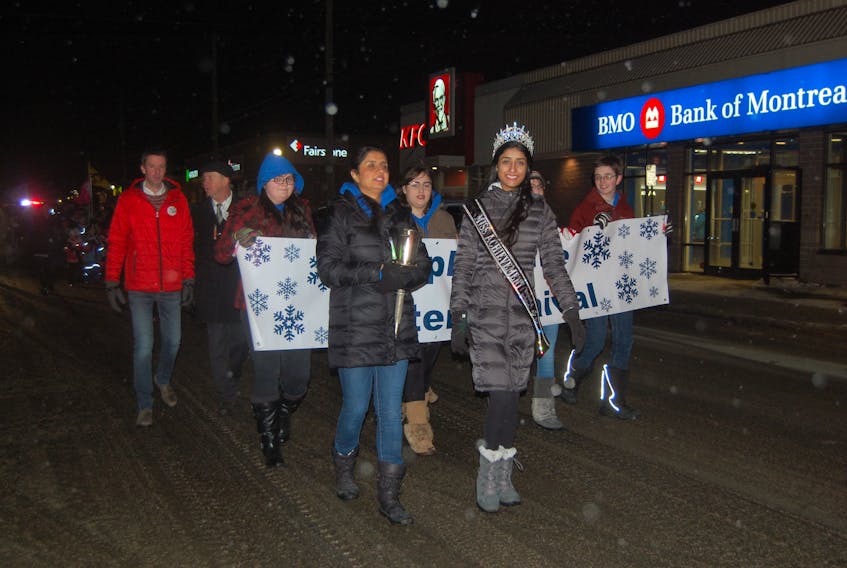 Rosie Verma, left, Citizen-of-the-Year 2016, and her daughter Radhika Verma of Stephenville, Miss Achievement Newfoundland and Labrador 2018, followed closely by four carnival ambassadors, led the parade down Main Street that kicked off Stephenville Winter Carnival 2018 on Thursday evening.
