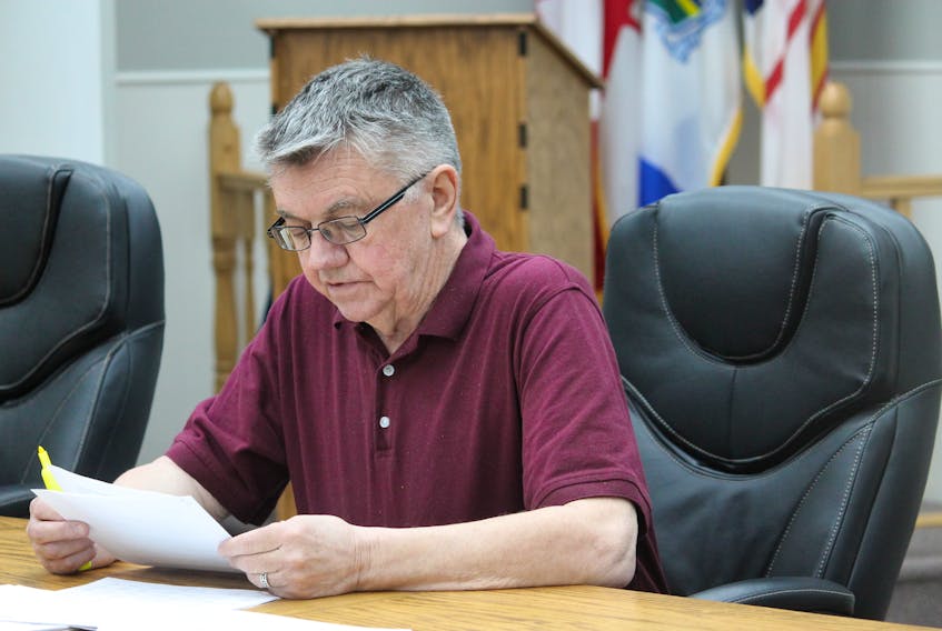 Mike Tobin, a member of the Town of Stephenville’s finance committee, reads out finance items during Thursday’s regular general meeting.