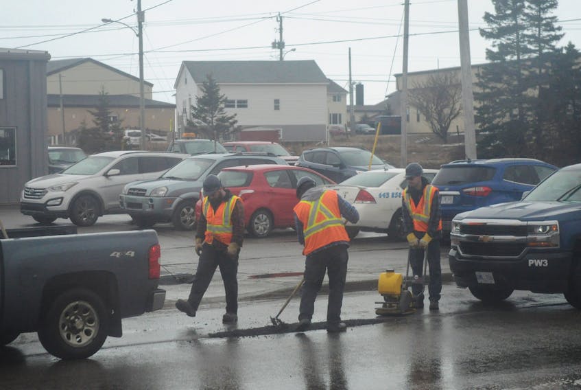 Employees with the Town of Stephenville’s Public Works division were busy Monday carrying out asphalt patching on some of the many potholes in the town, including this one located in front of OK Tire on Prince Rupert Drive near its intersection with Boland Drive.