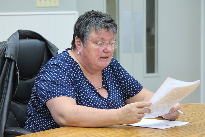 Deputy Mayor Susan Fowlow, chairperson of the Stephenville town council’s planning and traffic committee, is seen reading out permit requests at Thursday’s meeting.