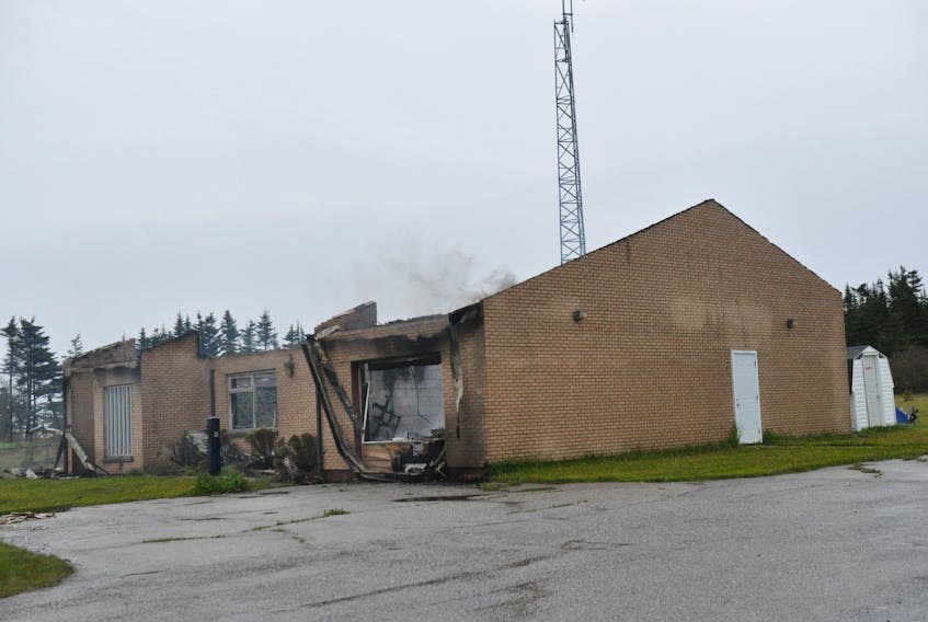 Smoke was still billowing from the former RCMP Building in Piccadilly late this morning after it was destroyed by an early morning fire.