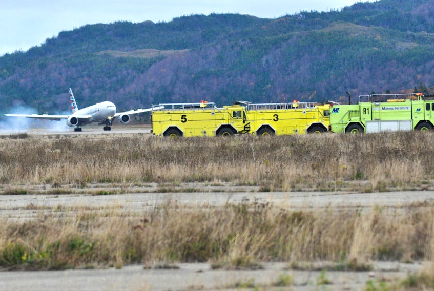 With crash firefighting services on hand, an American Airlines Boeing 777 is seen making an emergency landing at Stephenville airport this afternoon.