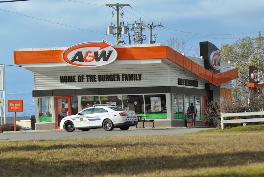 A RCMP patrol car is seen in front of A & W Restaurant in Stephenville late Saturday morning as an investigation into an early morning robbery was taking place and continues.