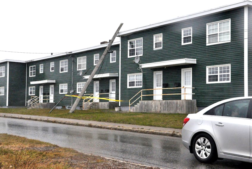 An aged utility pole on New Mexico Drive was one of the casualties of high winds in Stephenville on Sunday as the structure gave wave and brought up on the roof edge of an apartment complex. Lorraine Gaudet, a weather observer at Stephenville airport, said gusts of up to 113 km/h were recorded at the airport on Sunday.