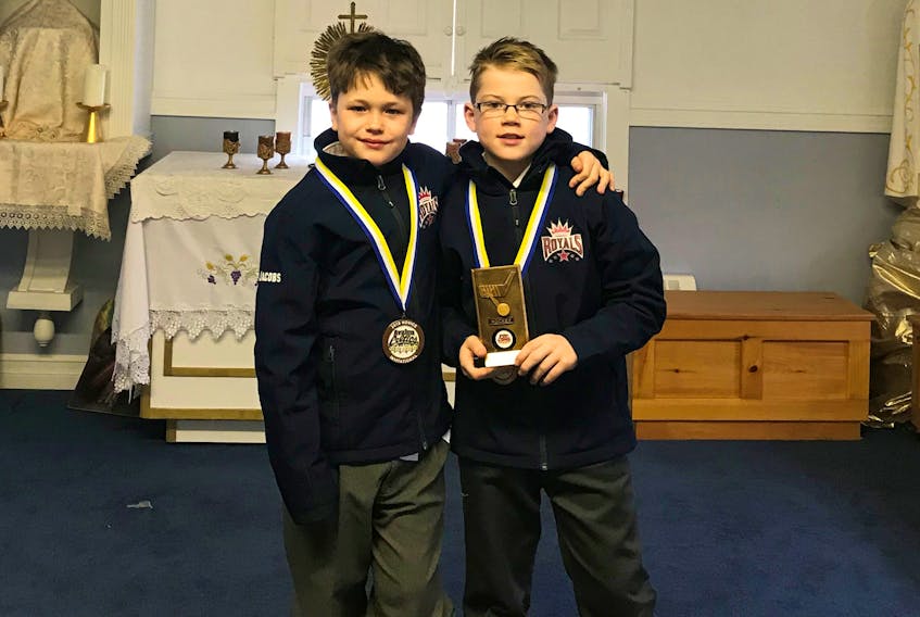 Danyael Jacobs and Mark Janes received bronze medals in a Novice Hockey Tournament in St. John's. Mark also received an award for Most Valuable Player for the tournament.