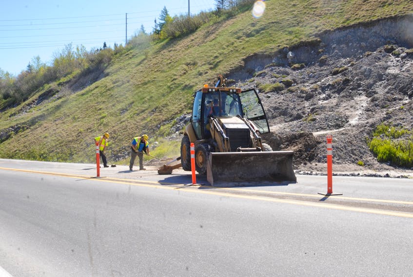 A Department of Transportation and Works crew was dispatched to clean up debris from a small landslide that had encroached onto the off-ramp from the Trans-Canada Highway to the Lewin Parkway in Corner Brook and to properly re-paint the shoulder section Wednesday morning.