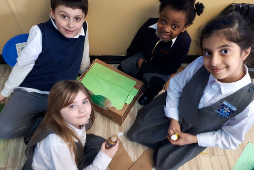 Students in Mme. Ryan's French Immersion class,  back (L-R): Remy Power, Lysea Ngania, and front (L-R): Maggie Payne, and Yasmin Alkhalil, made traps to catch the leprechaun and steal his gold treasure.