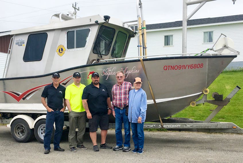 Derrick McKay, left, Steve Wilton and Dave Lewis of the Deer Lake Underwater Recovery Team and Gene Ralston and Sandy Ralston of Idaho are in Labrador helping search for the body of missing North West River man Luke Cooper. — Photo courtesy of the Deer Lake Underwater Recovery Team