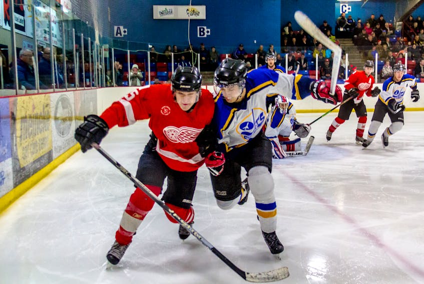 The Deer Lake Red Wings and Stephenville Jets do battle in action from the West Coast Senior Hockey League in 2017. – Randy Alexander photo