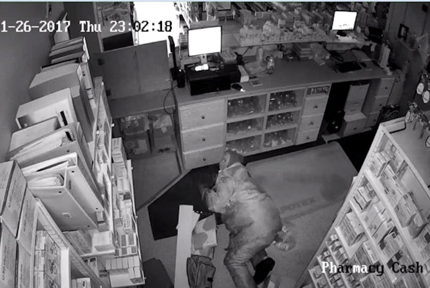 This image from security footage shows the alleged break-in at the PharmaChoice pharmacy in Flower's Cove in late January.