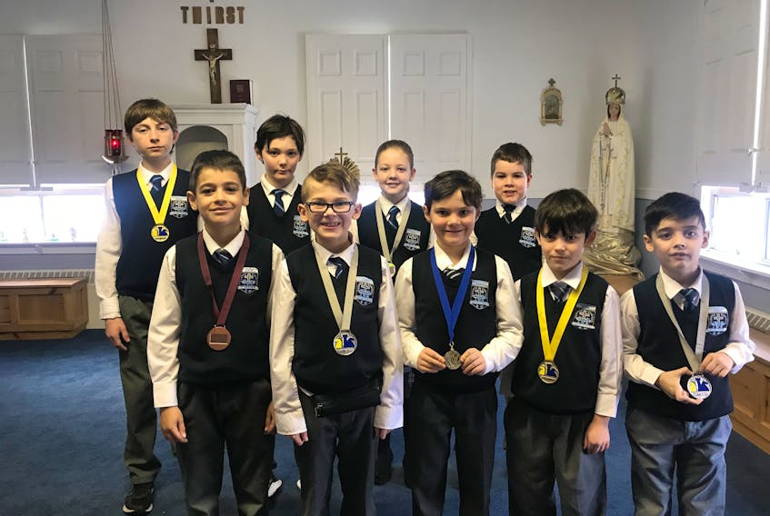 A number of students from Immaculate Heart of Mary School in Corner Brook earned a trip to the provincial chess tournament March 10 in St. John's based on their results at the western regional chess tournament held earlier this year. Those qualifying for the provincial event include, from left (front) Jack Watton (bronze Grade 3), Allister MacDonnell (silver Grade 4), Uriah Cull (silver Grade 3), Fabian Ryan (gold Grade 1) and Hunter Olmstead (silver Grade 1); (back) Daley Merrigan (gold Level 1), Jacob Cull (Qualifier Grade 5), Candace Johannesen (silver Grade 5) and Noah Wall (qualifier Grade 3).
