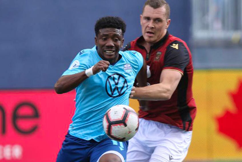 HFX Wanderers FC striker Akeem Garcia (left) and Adam Mitter of Valour FC battle for the ball during a Canadian Premier League match on May 11 in Winnipeg. The teams will face each other in the next round of the Canadian championship. The first leg is Wednesday evening at the Wanderers Grounds. Chris Procaylo / Winnipeg Sun