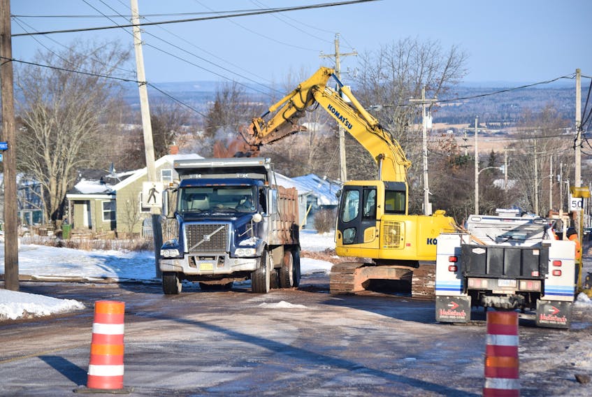 Public Works crews work on excavating a broken water main on Young Street Thursday morning after two lines broke in the area Wednesday. Both Young Street and Beechwood Drive are closed, and a detour has been set up on Fairview Drive, Pleasant Street, and Glenwood Drive.