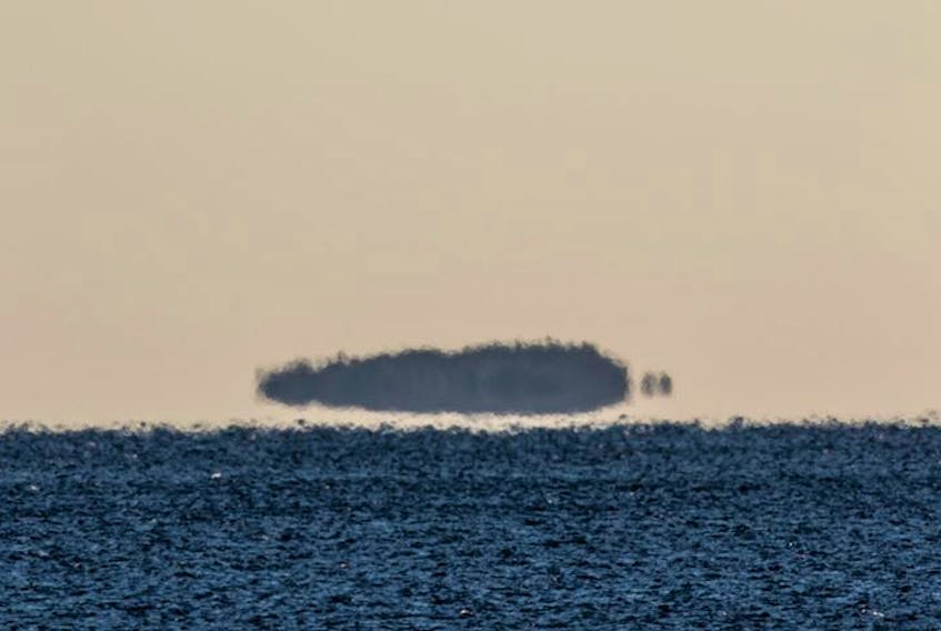 Barry Burgess was at the right place at the right time and snapped this amazing photo on a cold winter’s day near Queensland, N.S. 
The island, which Barry believes to be Shut-in Island, appears to be levitating above the water or looming.