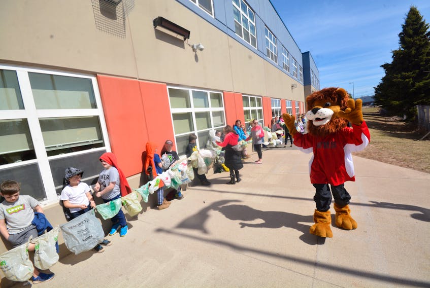 Cheered on by the school mascot Roary, the students of West Highlands Elementary learned they could circle around their school almost 13 times with the number of grocery bags they collected for Earth Day.