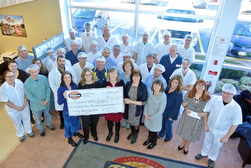 Employees and management at Weston Bakeries’ Amherst plant present a $116,000 cheque to representatives of the Cumberland County Health Care Foundation and Mental Health and Addictions Services as the latest recipient of support from the Amherst employees and George Weston Limited’s Weston Seeding Stronger Communities Initiative.