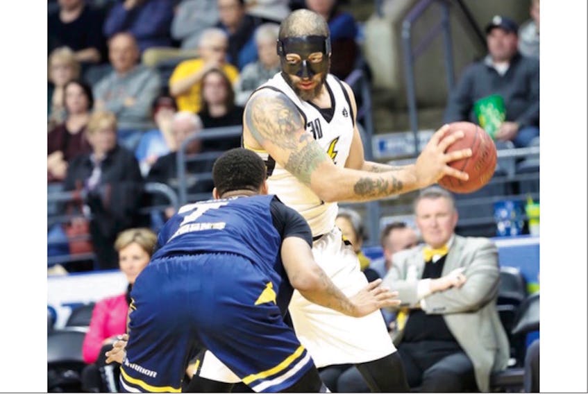 Masked man Royce White (30) and the London Lightning stole a win from Jarion Henry (7) and the St. John's Edge Wednesday night. — London Lightning/http://www.lightningbasketball.ca