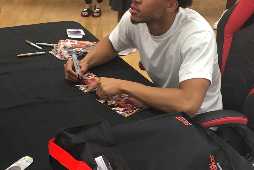 Lindell Wigginton was a big hit on Friday as over 300 people packed Staples on Woodlawn Road as part of Staples Canada School Drive, a meet-and-greet in which the popular hoops player was handing out autographs and free backpacks.