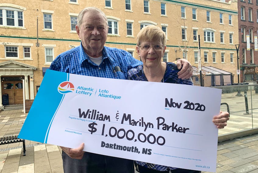 William and Marilyn Parker of Dartmouth show off their big cheque after winning $1 million in Lotto 6/49's Guaranteed Prize for the Nov. 14, 2020, draw.