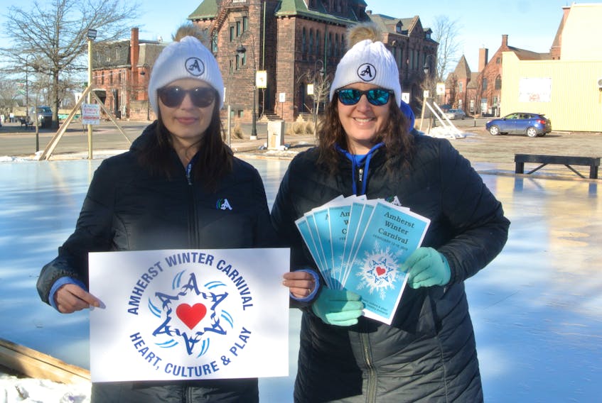 Amherst’s culture, events and marketing co-ordinator Jennifer Bickerton (left) and active living co-ordinator Tamara Porter hold up the Amherst Winter Carnival logo and brochures in preparation for the fifth annual winter celebration from Tuesday, Feb. 12 to Monday Feb. 18. There are more than 100 events taking place throughout Amherst.
